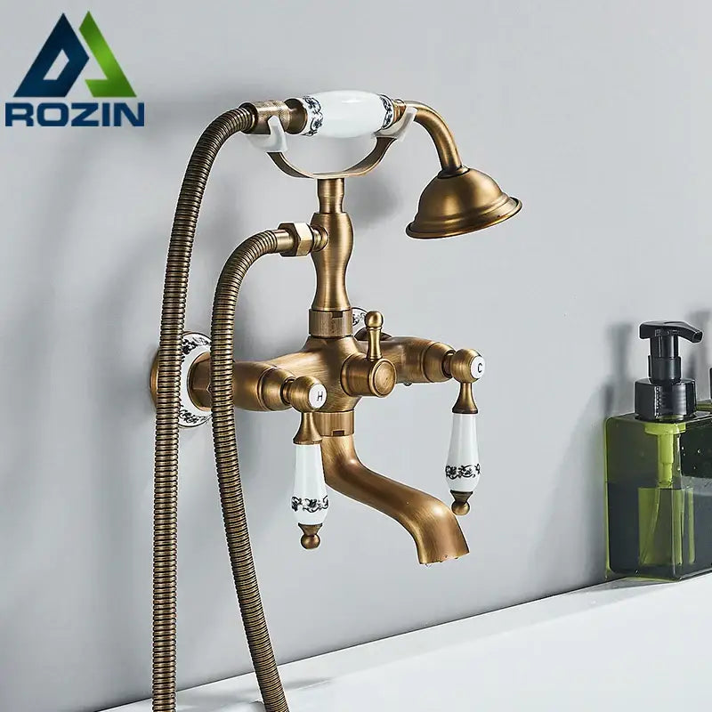 Antique brass and white ceramic shower faucet set with black floral handles and matching bathtub shower faucet