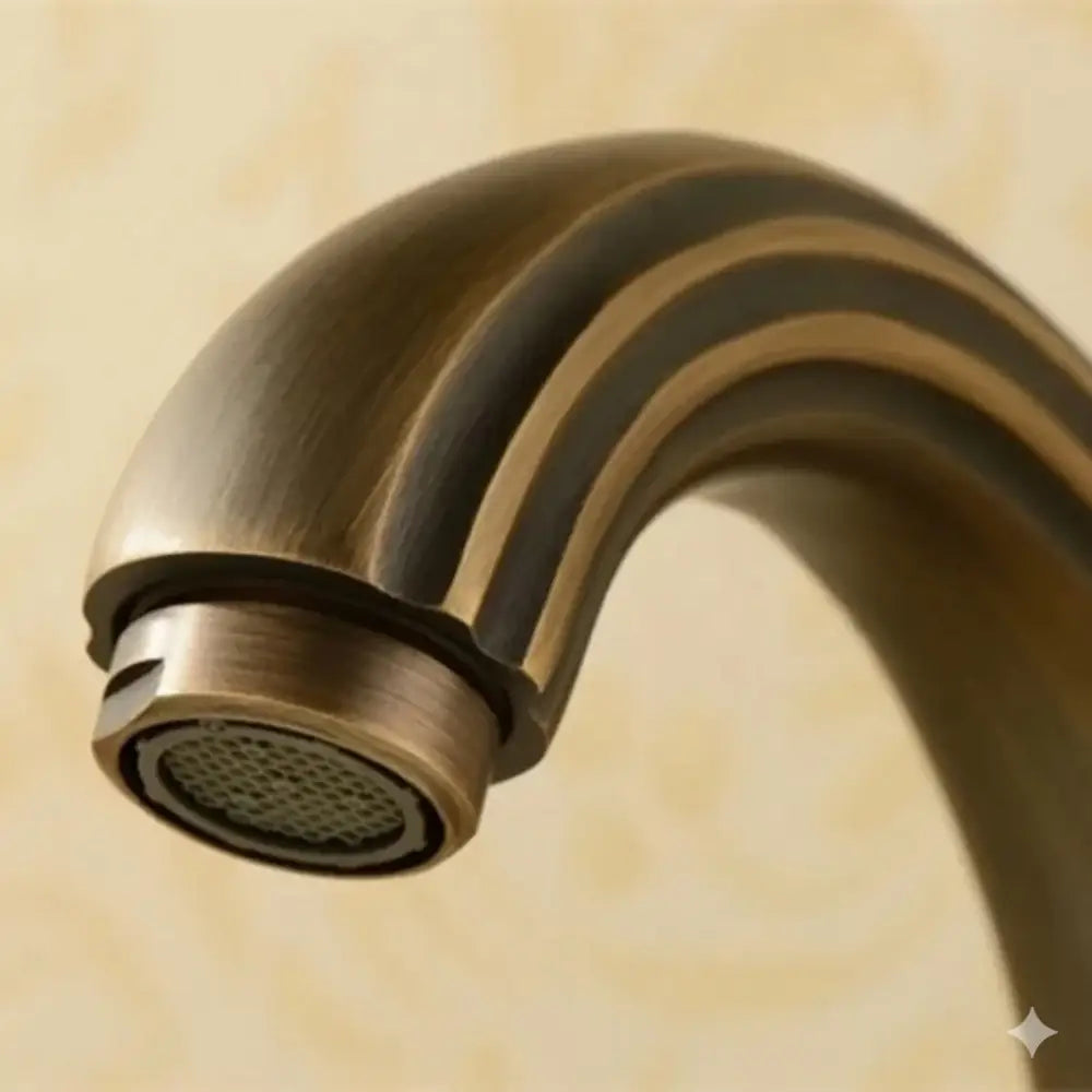 Antique brass bathroom faucet set with double handles and decorative horizontal ridges on curved spout brass bathroom faucet