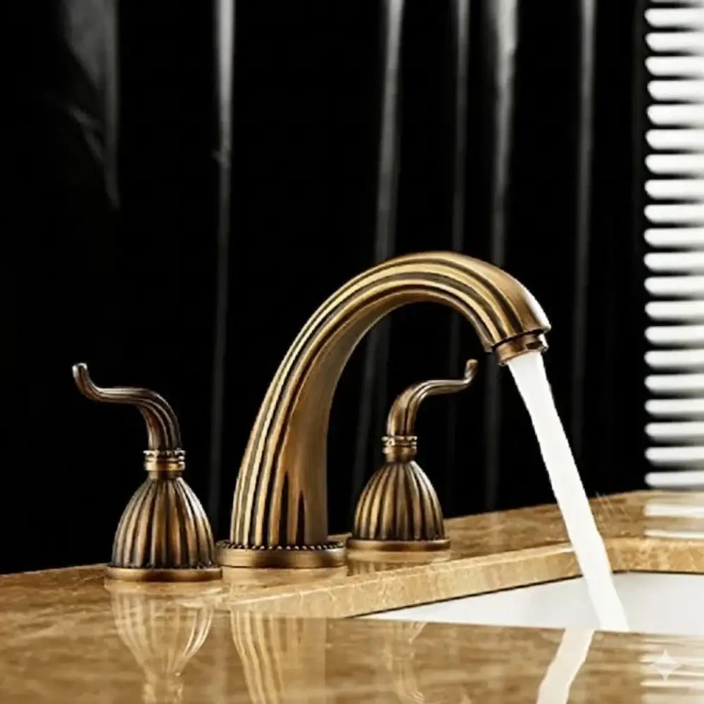 Antique brass bathroom faucet set featuring a brass bathroom faucet with three handles and ornate fluted design