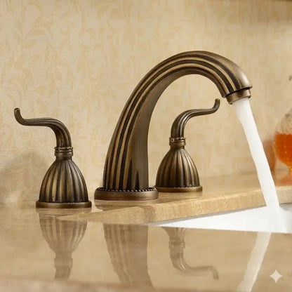 Antique brass bathroom faucet set with three fluted ornate handles in antique brass finish for elegant use