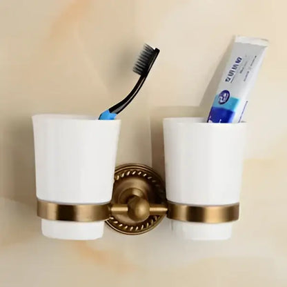 White ceramic toothbrush holder with gold-toned metal accents from decorbites brass bathroom ornate set