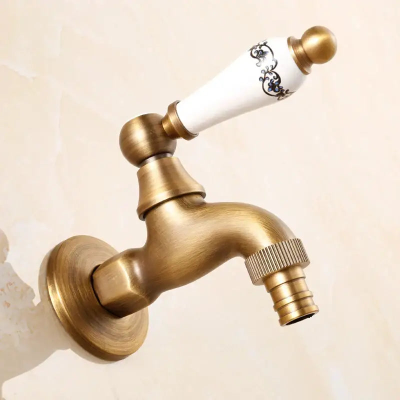 Antique brass bibcock faucet with white ceramic handle featuring black floral patterns for garden use decorbites brass antique