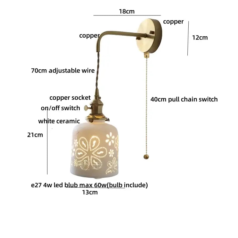 Antique brass ceramic led wall light with copper-finished sconce and white shade featuring floral cutouts and 70cm wire