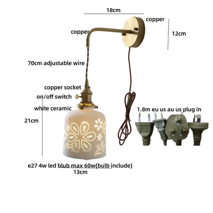Antique brass ceramic led wall sconce with white floral ceramic led shade and adjustable copper arm for bedroom decorbites