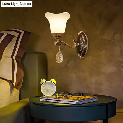 Antique brass wall lamp with frosted glass shade and crystal drop featuring e12 e14 base for bedroom sconce use