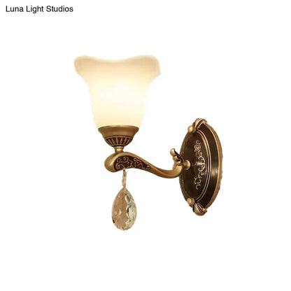Antique brass wall lamp with frosted glass shade and crystal drop featuring e12 e14 base for bedroom sconce use