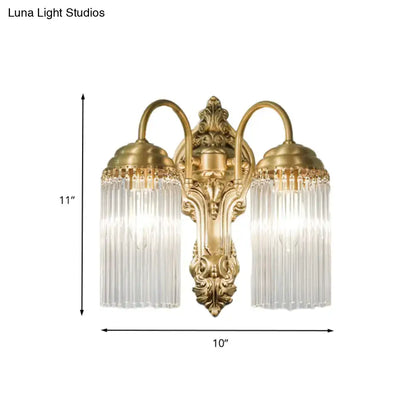 Antique brass crystal rod wall sconce with gold-toned ornate arms and clear glass shades for corridor lighting