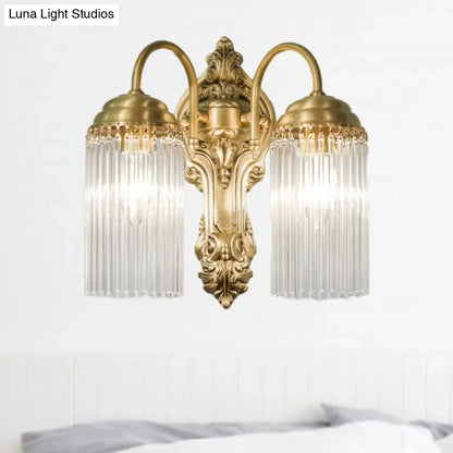 Antique brass crystal rod wall sconce with two lights ornate detailing and cascading crystal prisms for corridor lighting
