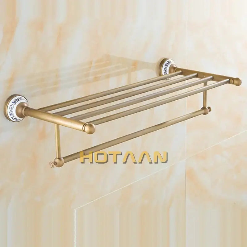 Antique brass double tier towel rack with four horizontal bars and decorative ceramic towel holder end caps