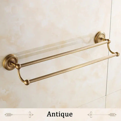 Antique brass double towel bar bathroom rack with ornate circular wall mounts and rounded end caps