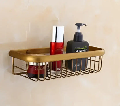 Gold-toned metal wire shower caddy in antibque brass floral bathroom hardware set for organized brass bathroom decorbites