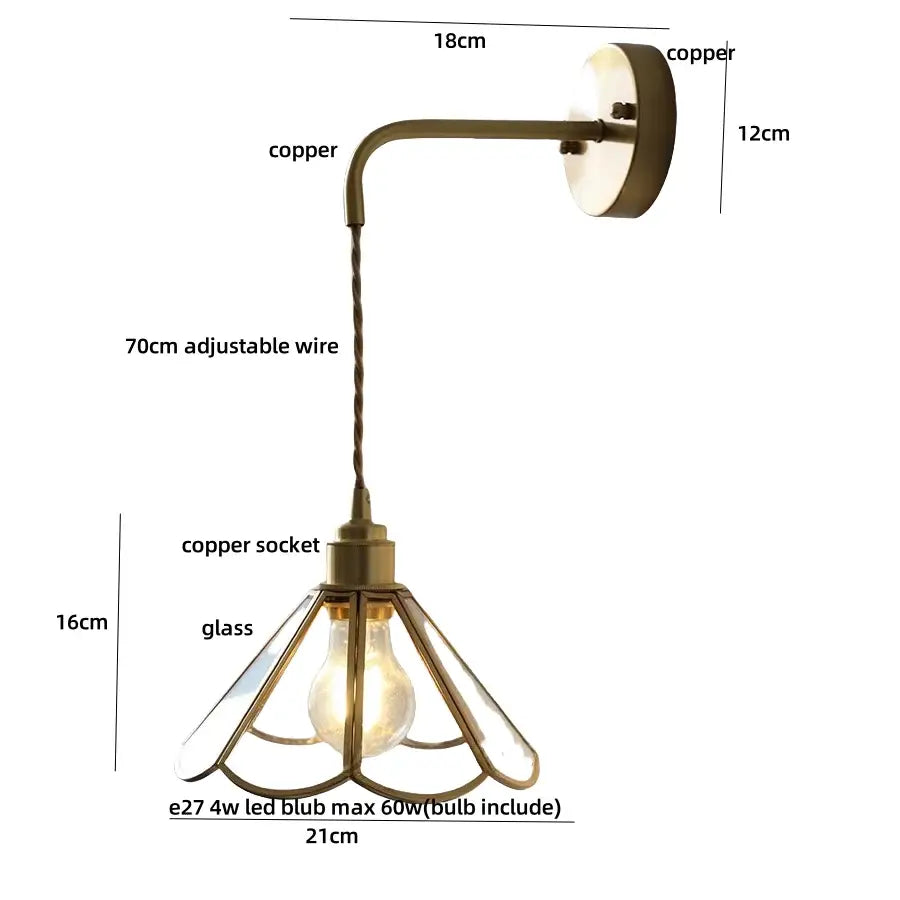 Copper wall light with glass shade and adjustable wire featuring antique brass flower design and pull chain for bedroom use