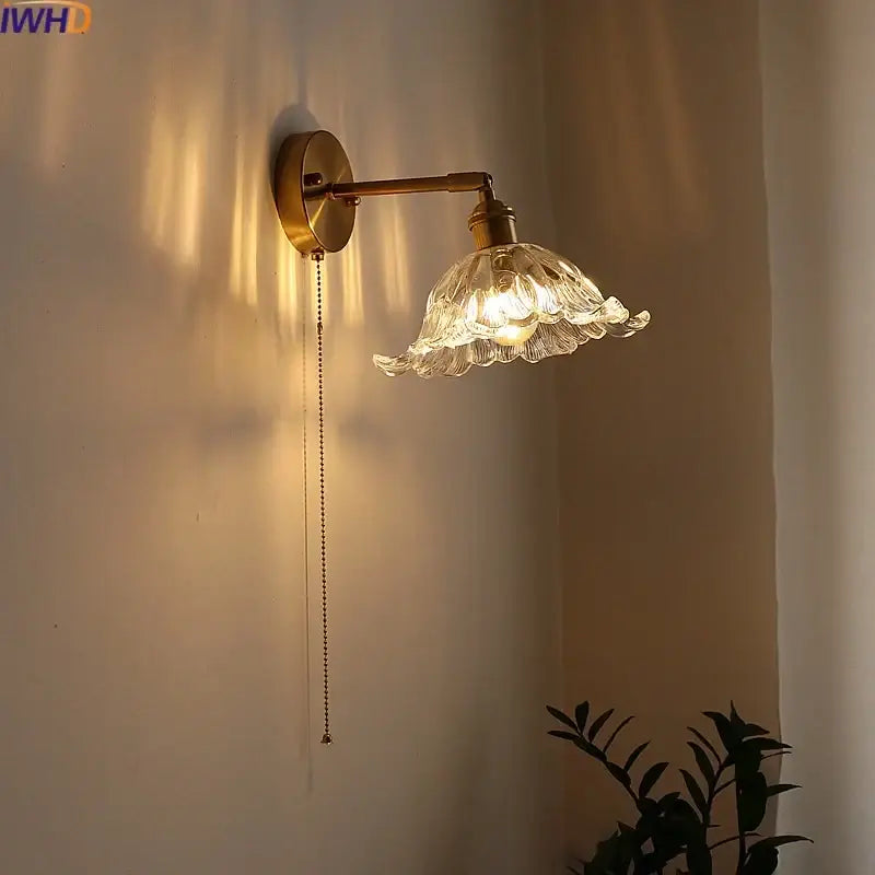 Antique brass wall lamp with a delicate clear glass flower-shaped shade and pull chain sconce led wall fixture