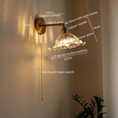 Antique brass flower glass sconce led wall lamp with brass-finished copper arm and ornate petal-shaped shade for bedroom
