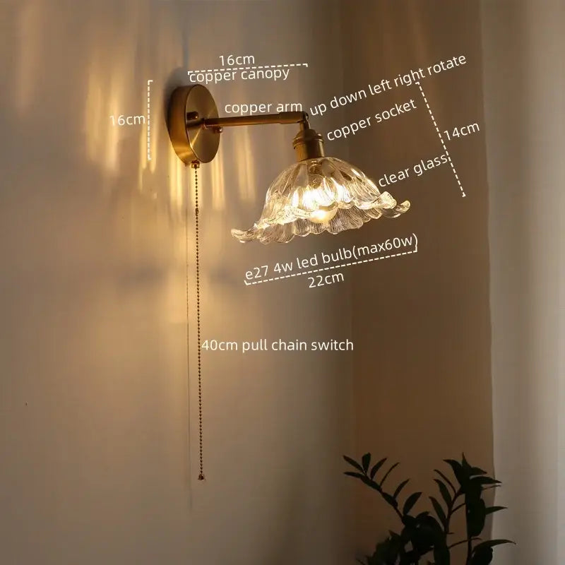 Antique brass flower glass sconce led wall lamp with brass-finished copper arm and ornate petal-shaped shade for bedroom