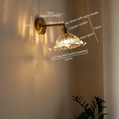 Antique brass flower glass sconce led wall lamp with a brass finished copper canopy and clear blooming glass shade