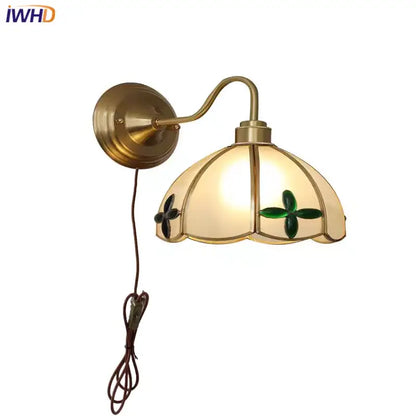 Antique brass glass brass wall sconce with cream glass shade featuring green clover motifs for dining room decorbites wall fixture