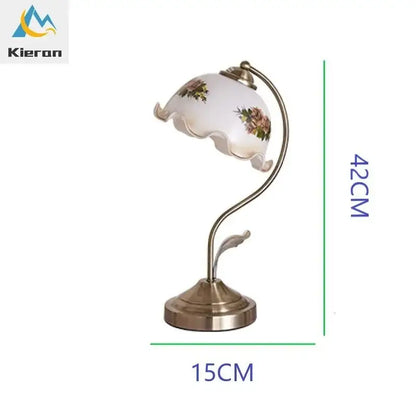 Antique brass glass flower led desk lamp with white scalloped glass flower shade and curved brass base for bedroom use