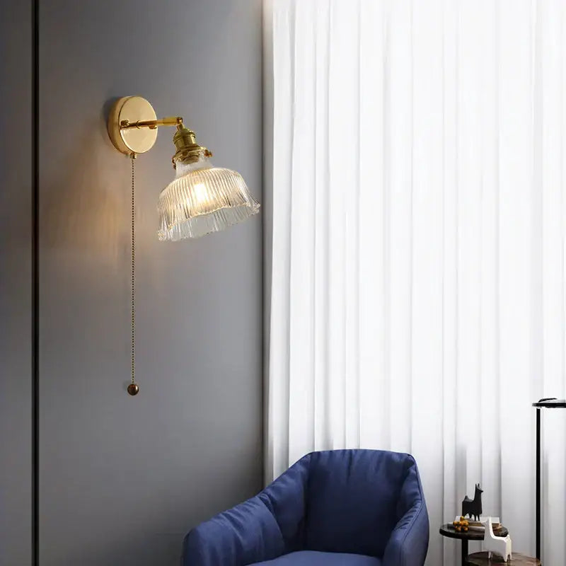 Antique brass glass rotate copper wall sconce with gold-toned ribbed shade and ornate pull chain for bedroom lighting