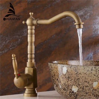 Antique brass ornate decorbites basin sink faucet with curved spout and vintage-style handle for bathroom use