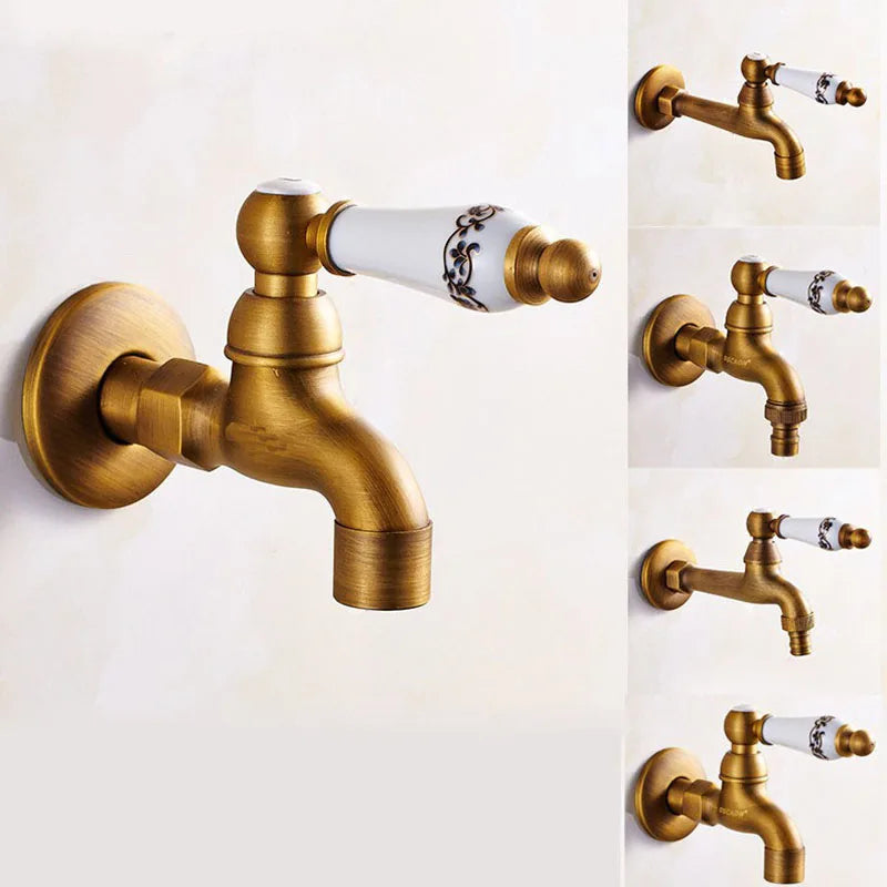 Antique brass single hole outdoor faucet with white ceramic handle featuring black floral detailing housing material metal