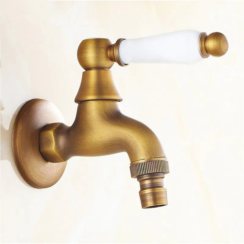 Antique brass outdoor faucet with single hole housing material featuring white ceramic handle and gold decorative accents