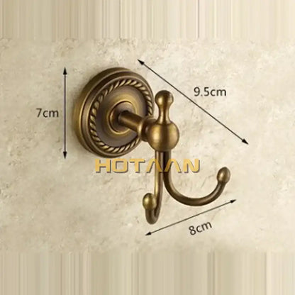 Antique brass rope wall hooks with ornate detailing on circular base double coat hanger for bathroom use brass wall hooks