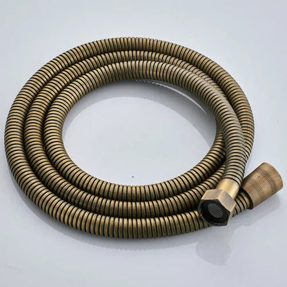 Brass-colored corrugated shower hose with hexagonal connector and textured nozzle in antique brass shower faucet set