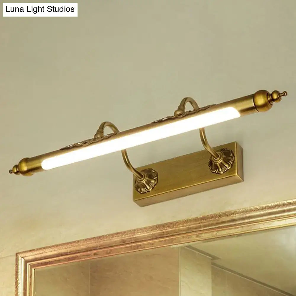 Antique brass shell vanity light with ornate floral design and sleek led bar supports maximum bulb wattage 60w
