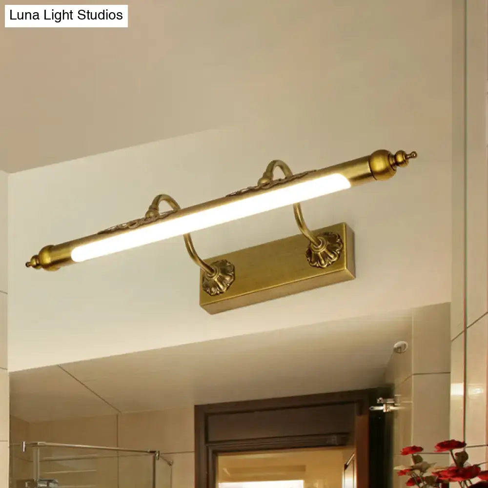 Antique brass shell vanity light with wired electric connection and 60w maximum bulb wattage featuring ornate scrollwork and led bar
