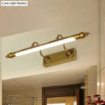 Antique brass shell vanity light with wired electric connection and 60w maximum bulb wattage featuring ornate scrollwork and led bar