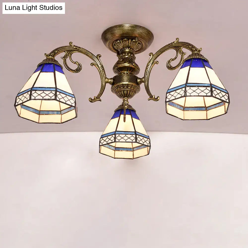 Antique brass-finished decorbites tiffany style ceiling light with three blue and cream stained glass bell shades