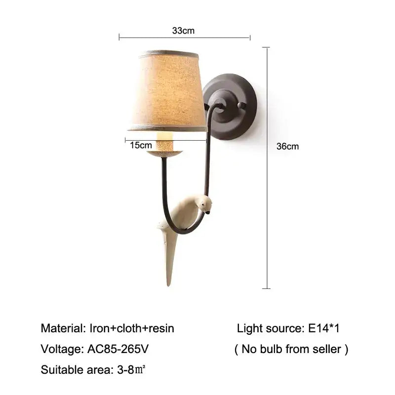 Antique bronze wall lamp with cream ceramic bird decor and beige fabric shade ideal for bedroom decorbites bird decor