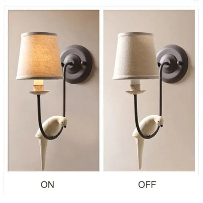 Antique bronze and cream ceramic bird wall lamp with white parrot sconce and dark metal frame for bedroom decorbites bird decor