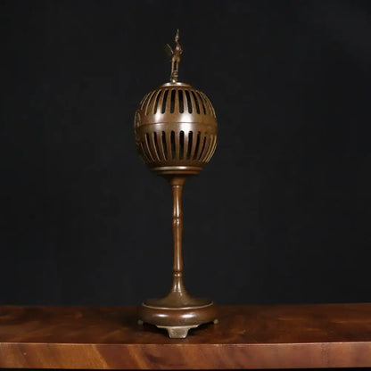 Antique bronze crane incense burner with vertical slits and small figurine dome for living room decorbites decor