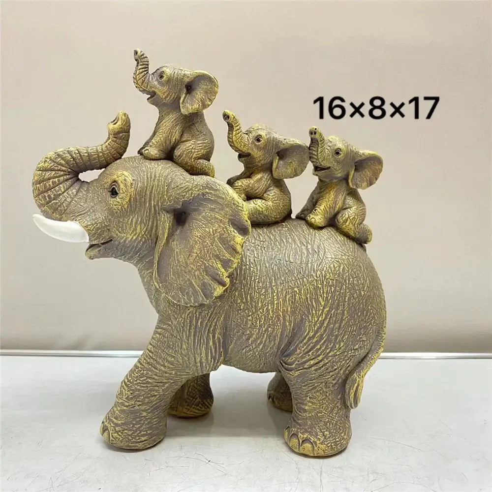 Antique bronze elephant family figurine featuring golden-toned resin with textured skin and three smaller elephants on back