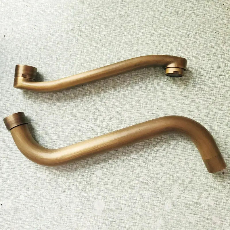 Two bronze-finished curved metal door handles for antique bronze single cold wall mounted kitchen mop pool faucet