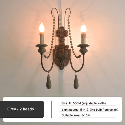 Antique country french wall lamp in grey metal with two candle arms and beaded chain pendants for living room decorbites country french wall