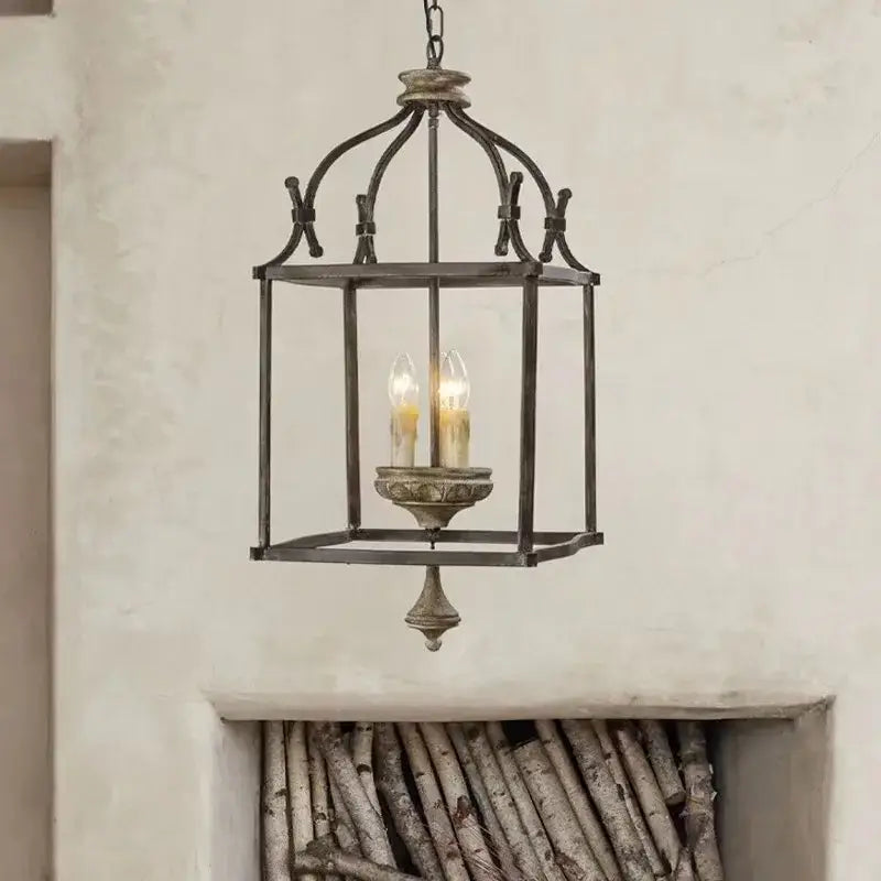 Antique dark bronze chandelier light with creative American iron frame and glowing candle bulbs for kitchen decorbites creative American iron