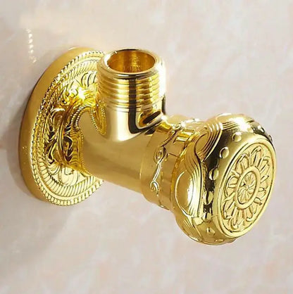 Golden ornate antique floral brass bathroom angle stop valve with intricate scrollwork detailing for bathroom use