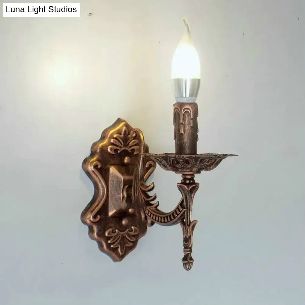Antique gold retro european wall light bronze finished ornate candle style wall sconce with single illuminated bulb