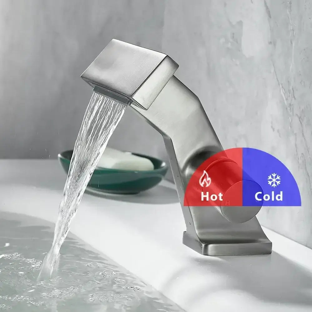 Modern brushed stainless steel single hole waterfall faucet with dual control knobs and sleek angular design