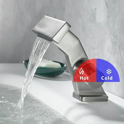 Modern brushed stainless steel single hole waterfall faucet with dual control knobs and sleek angular design
