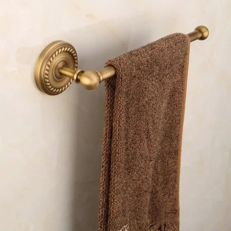 Antique ornate brass round towel ring with a brown textured towel hanging decorbites brass bathroom holder