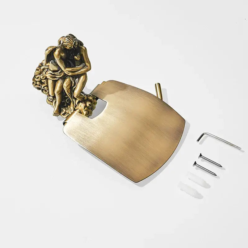 Antique ornate bronze toilet paper holder with brass door lock featuring angel and cherub figurine design