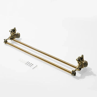 Antique ornate gold and silver brass double towel bars with sculpted figures at each end for bathroom use