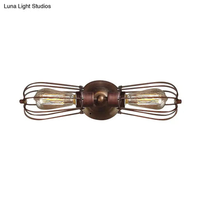Antique style black bronze sconce light with two filament bulbs in wire cages and bronze metal base for dining room
