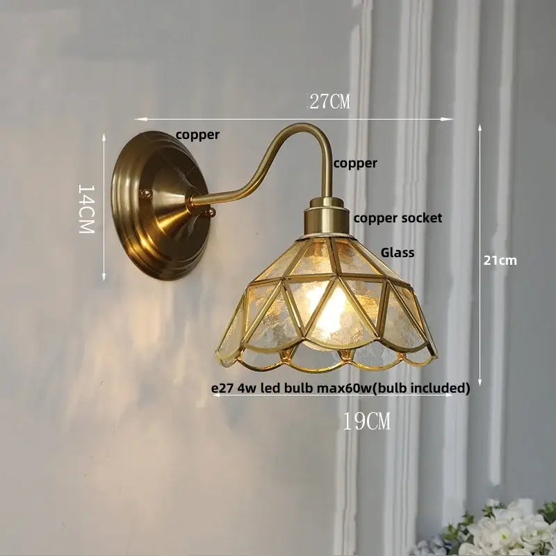 Antique teal glass and brass wall light fixture with geometric glass shade designed as a bedroom wall light sconce