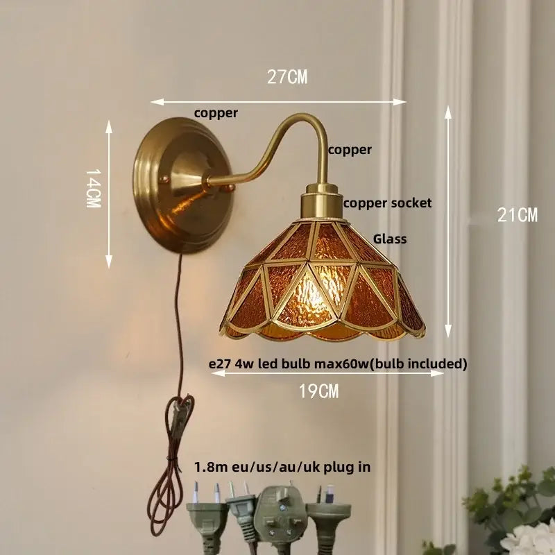 Antique brass and copper wall light fixture with amber gold stained glass shade for bedroom sconce lighting