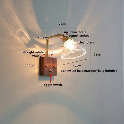 Antique walnut and brass clear glass wall light with copper-finished arm mounted on walnut wood base by decorbites clear glass